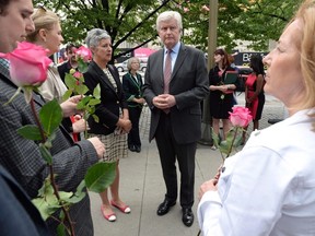 British High Commissioner to Canada Howard Drake, middle right, joins others as they take part in an event titled 'More In Common: A Worldwide Celebration of Jo Cox' at the British High Commission in Ottawa on Wednesday, June 22, 2016. Drake, Britain's envoy to Canada, says it is lazy to equate the rise of Donald Trump in the U.S. to his country's controversial decision to leave the European Union. (THE CANADIAN PRESS/Sean Kilpatrick)