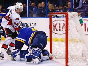 Senators forward Jean-Gabriel Pageau scores a goal against St. Louis Blues goalie Carter Hutton during Tuesday night’s game. (AP)