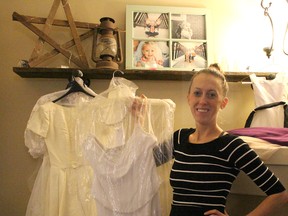 Stacey Marshall, of Sarnia, shows off some of the wedding dresses donated for her Pay It Forward Pop-up Bridal Boutique. The two-day event will allow brides-to-be to purchase gently used wedding dresses at a fraction of their original cost. All of the proceeds from the event will be donated to Noelle's Gift. Barbara Simpson/Sarnia Observer/Postmedia Network
