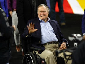 In this April 2, 2016, file photo, former president George H.W. Bush waves as he arrives at NRG Stadium before the NCAA Final Four tournament college basketball semifinal game between Villanova and Oklahoma in Houston. Houston-area media are quoting former president George H.W. Bush's chief of staff as saying that Bush has been hospitalized in Houston. (AP Photo/David J. Phillip, File)