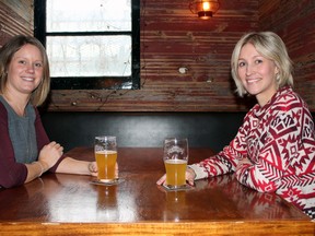 Anne Caldwell (left) and Pia Fjellstršm, the founders of She's Crafty YGK, enjoy a pint at the Red House on King Street in Kingston on Tuesday. (Charlie Pinkerton/For The Kingston Whig-Standard