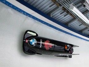 Canada's Kaillie Humphries and Cynthia Appiah compete in a women's bobsled race in Whistler, B.C., on Dec. 3, 2016. The Canadian Olympic Committee is teaming with a big data company to ramp up analytics for athletes. (Darryl Dyck/The Canadian Press)