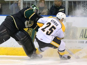 Tyler Parsons of the Knights has to hurry to move the puck before a forechecking Jordan Kyrou of the Sting gets his stick on it during the first period of their game Wednesday night at Budweiser Gardens in London, Ont. (MIKE HENSEN, The London Free Press)