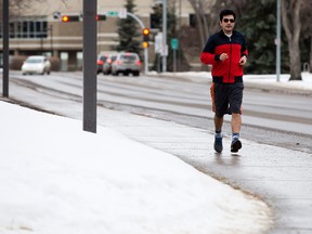 A jogger in shorts makes their way along 116 Street near 89 Avenue, in Edmonton Wednesday Jan. 18, 2017.