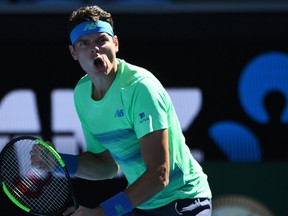 Canada's Milos Raonic celebrates beating Luxembourg's Gilles Muller in their men's singles second round match on day four of the Australian Open tennis tournament in Melbourne on January 19, 2017. (SAEED KHAN/AFP/Getty Images)