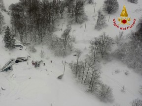 An aerial view of the Rigopiano Hotel hit by an avalanche in Farindola, Italy, early Thursday, Jan. 19, 2017. Rescue workers were met with an eerie silence Thursday when they reached a four-star spa hotel in a mountainous earthquake region of central Italy where authorities said at least 30 people were missing, including at least two children. (Italian Firefighters via AP)
