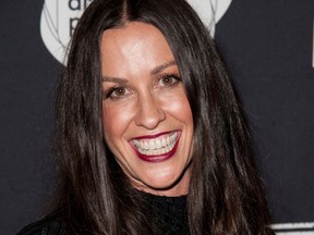 This June 20, 2014 file photo Alanis Morissette arrives at the 4th Annual Production Of The 24 Hour Plays After-Party in Santa Monica, Calif. Federal prosecutors say a business manager who embezzled more than $6.5 million from Morissette and other entertainment and sports figures has agreed to plead guilty. Jonathan Todd Schwartz agreed Wednesday, Jan. 18, 2017 to plead guilty in Los Angeles federal court to two felonies that carry a maximum of 23 years in federal prison. (Photo by Richard Shotwell/Invision/AP,File)