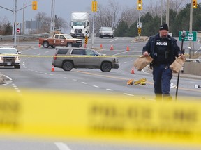 Durham Regional Police are investigating a deadly incident that saw a man in his 50s hit by a bus and thrown into oncoming traffic on Brock St., near Hwy. 401, in Whitby Thursday, Jan. 19, 2017. (CHRIS DOUCETTE/TORONTO SUN)