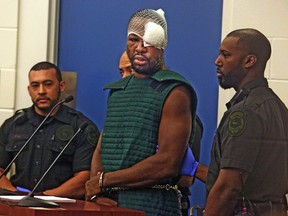 Markeith Loyd, suspected of fatally shooting a Florida police officer, attends his initial court appearance Thursday, Jan. 19, 2017, at the Orange County Jail, in Orlando, Fla. Loyd spoke out of turn and was defiant during the appearance on charges of killing his pregnant ex-girlfriend. He was injured during his arrest Tuesday night following a weeklong manhunt. (Red Huber/Orlando Sentinel via AP, Pool)