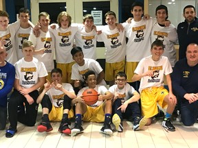 St. Joseph's junior boys' basketball team and coaches, champions of the Ram Rocker basketball tournament held last weekend at the school.