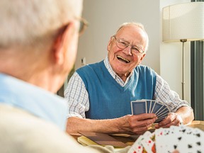 Playing cards is among the activities single male seniors can engage in to help alleviate loneliness, writes columnist Gerald Walton Paul. (Getty Images)