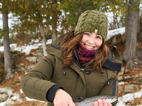 Jenn Mulvihill of Calabogie with her first-ever rainbow trout, caught during a recent women’s ice fishing trip.  (Supplied photo)