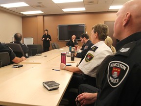 Kingston Police officers listen as Sharon Lewis, from the Alzheimer Society of KFL&A, as she begins a training session on communicating with people with dementia. She hopes all emergency responders will take the training. (Michael Lea/The Whig-Standard)