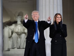 President-elect Donald Trump and his wife Melania Trump arrive at a pre-Inaugural "Make America Great Again! Welcome Celebration" at the Lincoln Memorial in Washington, Thursday, Jan. 19, 2017. (AP Photo/Evan Vucci)