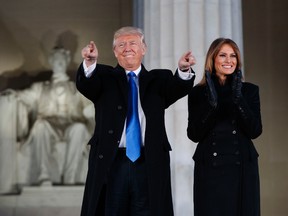 President-elect Donald Trump, left, and his wife Melania Trump arrive to the "Make America Great Again Welcome Concert" at the Lincoln Memorial on Thursdayin Washington. (AP Photo/Evan Vucci)