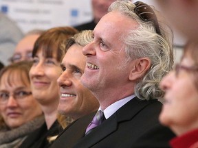 Rob McEwen along with Dr. Terrance Galvin, Founding Director of the Laurentian University, McEwen School of Architecture smile as they listen to speeches at the official grand opening of the school  in Sudbury, Ont. on Thursday January 19, 2017. Gino Donato/Sudbury Star/Postmedia Network