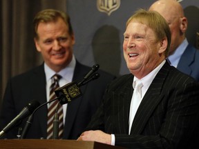 NFL Commissioner Roger Goodell (left) laughs as Raiders owner Mark Davis talks to the media after an NFL owners meeting in Houston on Jan. 12, 2016. The Raiders have filed paperwork to move to Las Vegas on Thursday. (Pat Sullivan/AP Photo/Files)