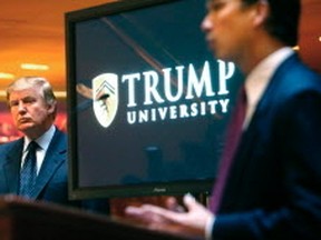 In this May 23, 2005 file photo, then real estate mogul and Reality TV star Donald Trump, left, listens as Michael Sexton introduces him at a news conference in New York where he announced the establishment of Trump University. (AP)