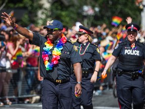 Toronto Police Chief Mark Saunders marches with officers in the Pride parade on Sunday, July 3, 2016. (Ernest Doroszuk/Toronto Sun)