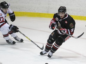 Sarnia Legionnaires defenceman Nash Nienhuis protects the puck from Jake Desando of the Lambton Shores Predators during the Greater Ontario Junior Hockey League game at Sarnia Arena on Thursday, Jan. 19, 2017 in Sarnia, Ont. Nienhuis had an assist as Sarnia won 4-3. (Terry Bridge, Postmedia Network)