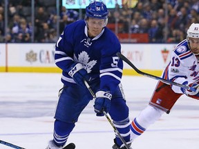 Jake Gardiner of the Toronto Maple Leafs gets away from Kevin Hayes of the New York Rangers during NHL action at the Air Canada Centre in Toronto on Thursday January 19, 2017. (Dave Abel/Toronto Sun/Postmedia Network)