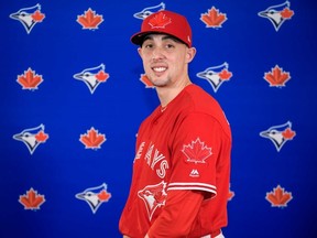 Blue Jays pitcher Aaron Sanchez shows off the new red jerseys the team will wear for select games this season in honour of Canada's 150th anniversary. (HANDOUT/PHOTO)