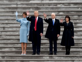 First Lady Melania Trump, U.S. President Donald Trump, vice-president Mike Pence and his wife Karen wave goodbye to former president Barack Obama's helicopter as it departs from the U.S. Capitol after Trump's inauguration ceremonies in Washington, DC, on Jan. 20, 2017. (AFP/PHOTO)