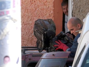 Forensic personnel work at the site where six dismembered bodies were found inside a car in Chilpancingo, Guerrero state, Mexico, on January 16, 2017. (EMILIANA BARRERA/Getty Images)