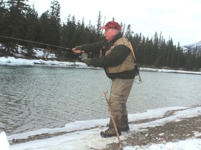 Neil casts a line for Athabasca River bull trout