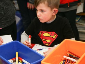 Myles, a student at St. Mary Catholic School, draws a picture of what makes him happy during a workshop session on Friday January 20, 2017 in Read, Ont.  Students rotated through three different activities as part of a mental health and wellness day at the school. Tim Miller/Belleville Intelligencer/Postmedia Network