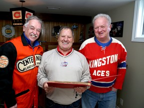 Players from successful 1967 local sports teams, from left, Bob Gilmour, Garry Lavallee and Ron Earl go over memories at Lavallee's Kingston's home on Monday January 16 2017. Ian MacAlpine /The Whig-Standard/Postmedia Network