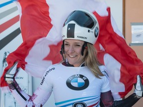 Mirela Rahneva, of Ottawa, celebrates her victory at a women's skeleton World Cup race in St. Moritz, Switzerland, on Friday, Jan. 20, 2017. (Urs Flueeler/Keystone via AP)