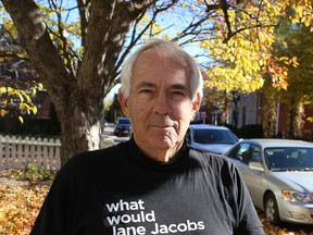 Geoff Smith, a Queen's University professor emeritus, is looking to involve as many people and groups as he can as he campaigns to curb student binge drinking. He stands in his front lawn on William Street in Kingston in November. (Elliot Ferguson/The Whig-Standard)