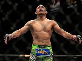 Tony Ferguson celebrates after defeating Abel Trujillo in their fight during UFC 181 at the Mandalay Bay Events Center in Las Vegas on Dec. 6, 2014. (Alex Trautwig/Getty Images)