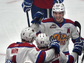 Edmonton Oil Kings forward Trey Fix-Wolansky (27) celebrates his goal against the Victoria Royals with Will Warm (4) and Colton Kehler (23) at Rogers Place in Edmonton on Jan. 19, 2017. (Ed Kaiser)