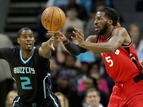 Raptors’ DeMarre Carroll attempts to make a pass against the Hornets in Charlotte on Friday night. (Getty Images)