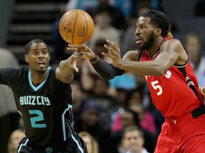 Raptors' Jonas Valanciunas and the Hornets Nicolas Batum  battle for the ball on Friday night. (Getty Images)