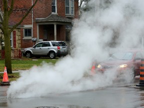 There is reduced visibility along Colborne Street, south of Oxford Street, caused by clouds of steam venting from manholes. (MORRIS LAMONT, The London Free Press)