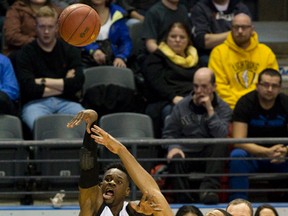 London Lightning player Tyshawn Patterson is fouled by Saint John Mill Rats player Doug Herring Jr. during their NBL Canada basketball game at Budweiser Gardens in London, Ont. on Thursday February 4, 2016. (Free Press file photo)