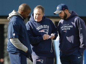 Patriots head coach Bill Belichick (centre) speaks with linebackers coach Brian Flores (left) and defensive line coach Brendan Daly (right) during a team practice in Foxborough, Mass., on Thursday, Jan. 19, 2017. (Steven Senne/AP Photo)