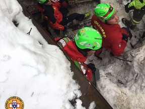 Rescuers work in the area of the avalanche-hit Rigopiano hotel, central Italy, Saturday, Jan. 21, 2017. (Corpo Nazionale Soccorso Alpino e Speleologico/The National Alpine Cliff and Cave Rescue Corps (CNSAS) via AP)