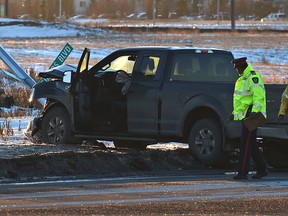 Police investigate a collision between two vehicle on 144 Ave. which they closed and Ebbers Rd. in north Edmonton, Friday, January 20, 2017. (Ed Kaiser)