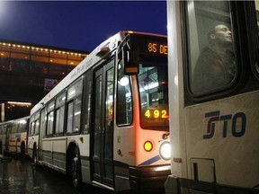A rider sits on an STO (Services Transport Outaouais) bus on Rideau street. Ottawa Sun