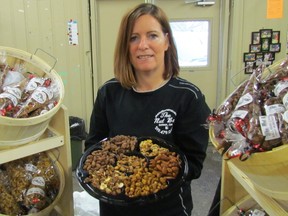 Miranda Sheppard, owner of The Nut Bar, mans her booth on Saturday January 21, 2017at the Farmers Market in Sarnia, Ont. Sheppard, a trained chef, started the nut roasting busines out of her Sarnia home. Paul Morden/Sarnia Observer/Postmedia Network