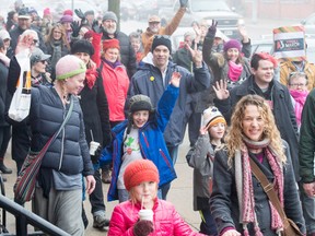 Some of the scores of marchers who took to the downtown sidewalks of Stratford are shown Saturday. PHOTO COURTESY MINDY GOUGH