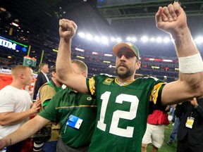 Packers quarterback Aaron Rodgers celebrates after defeating the Cowboys in Arlington, Texas, on Sunday, Jan. 15, 2017. (Ron Jenkins/AP Photo)