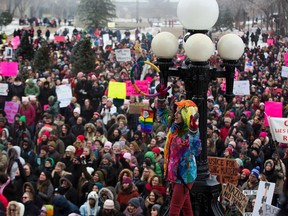 People take part in a rally at the Alberta Legislature. The Edmonton event is one of about 10 across Canada on Wednesday January 21, 2017. The event is in support of a Washington march for women's rights to protest the inauguration of U.S. president Donald Trump. Greg Southam / Postmedia