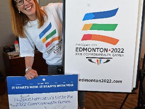 Aileen Giesbrecht, executive director of the Edmonton bid team, shows off paraphernalia from the city’s 2022 Commonwealth Games bid, which was called off in February 2015.