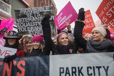Actresses Chelsea Handler and Charlize Theron, right, participate in the "Women's March On Main" during the 2017 Sundance Film Festival on Saturday, Jan. 21, 2017, in Park City, Utah. (Photo by Arthur Mola/Invision/AP)