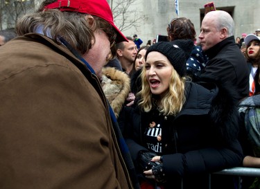 Madonna speaks with Michael Moore during the Women's March on Washington, Saturday, Jan. 21, 2017 in Washington. (AP Photo/Jose Luis Magana)